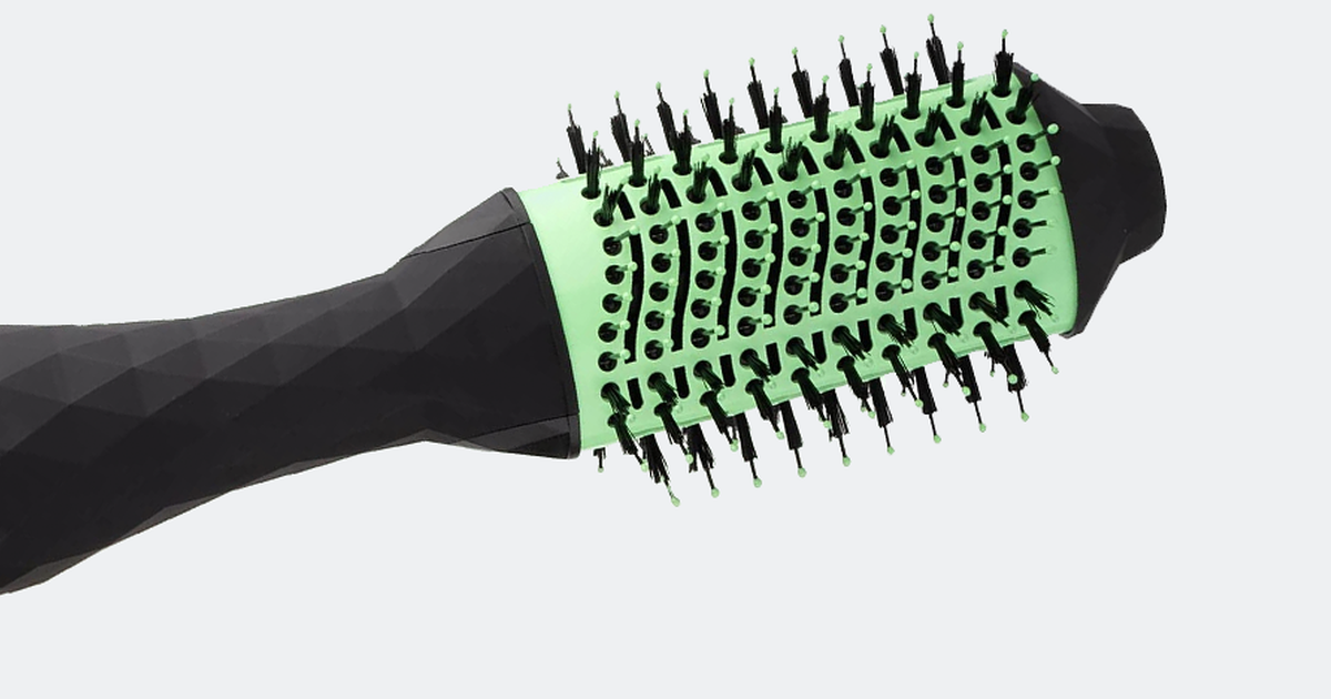 Close view of a ceramic blow dryer brush barrel showing mixed length bristles