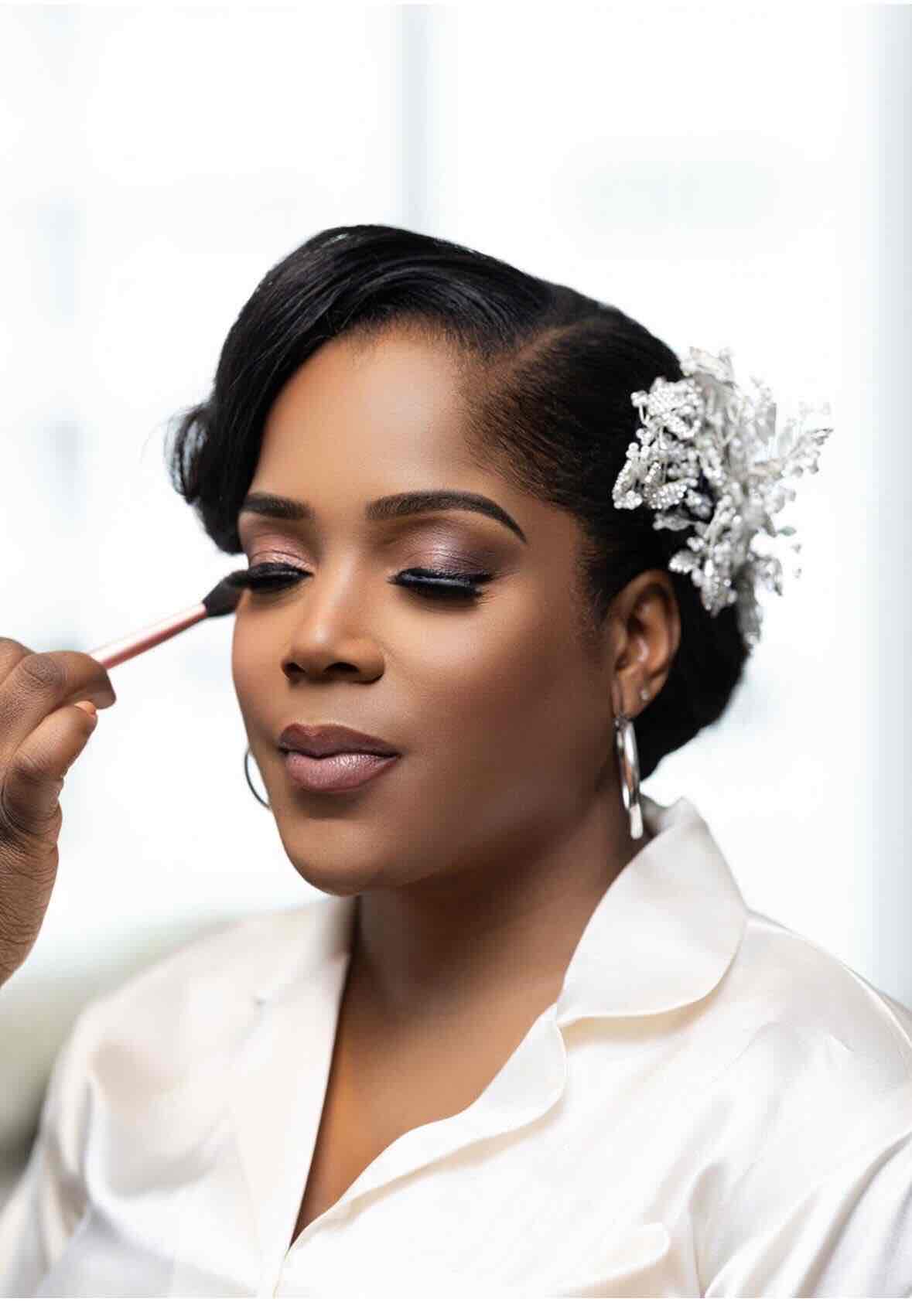 Bride having makeup applied by a Luxe Beauty Gallery artist